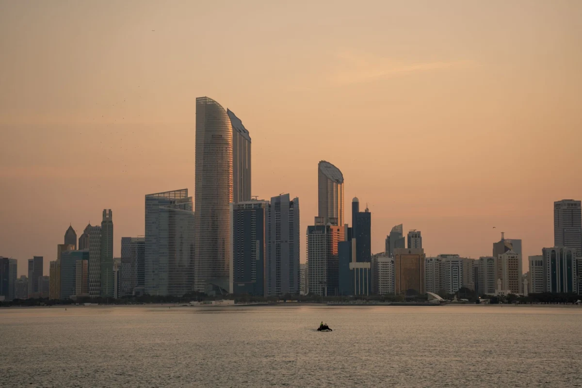 Abu Dhabi skyline with modern skyscrapers at sunset