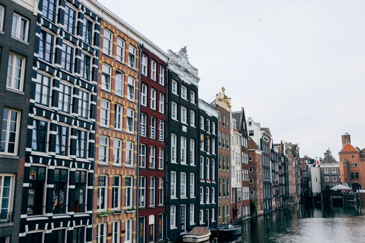 Picturesque Amsterdam canal houses along a serene canal