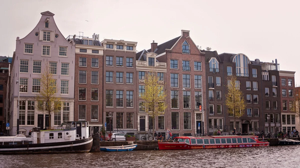 Scenic view of Amsterdam canal houses, perfect for group travel