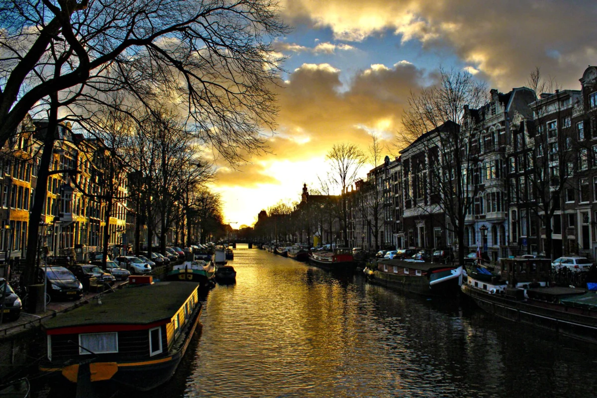 A romantic sunset view over Amsterdam's iconic canals