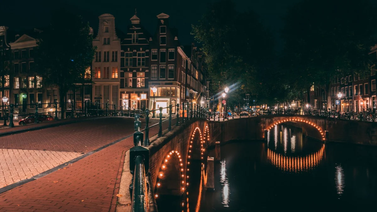 Amsterdam canals beautifully lit at night