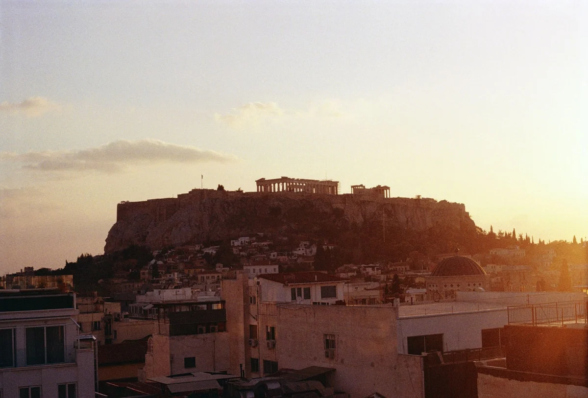 Athens Acropolis seen from a quiet city viewpoint at sunset