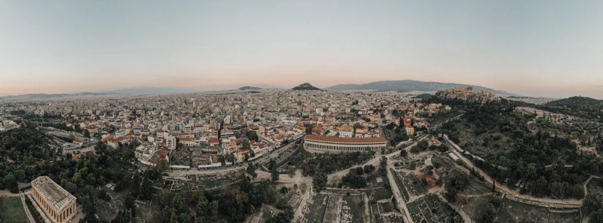 A breathtaking view of the Acropolis illuminated by the Athens sunset