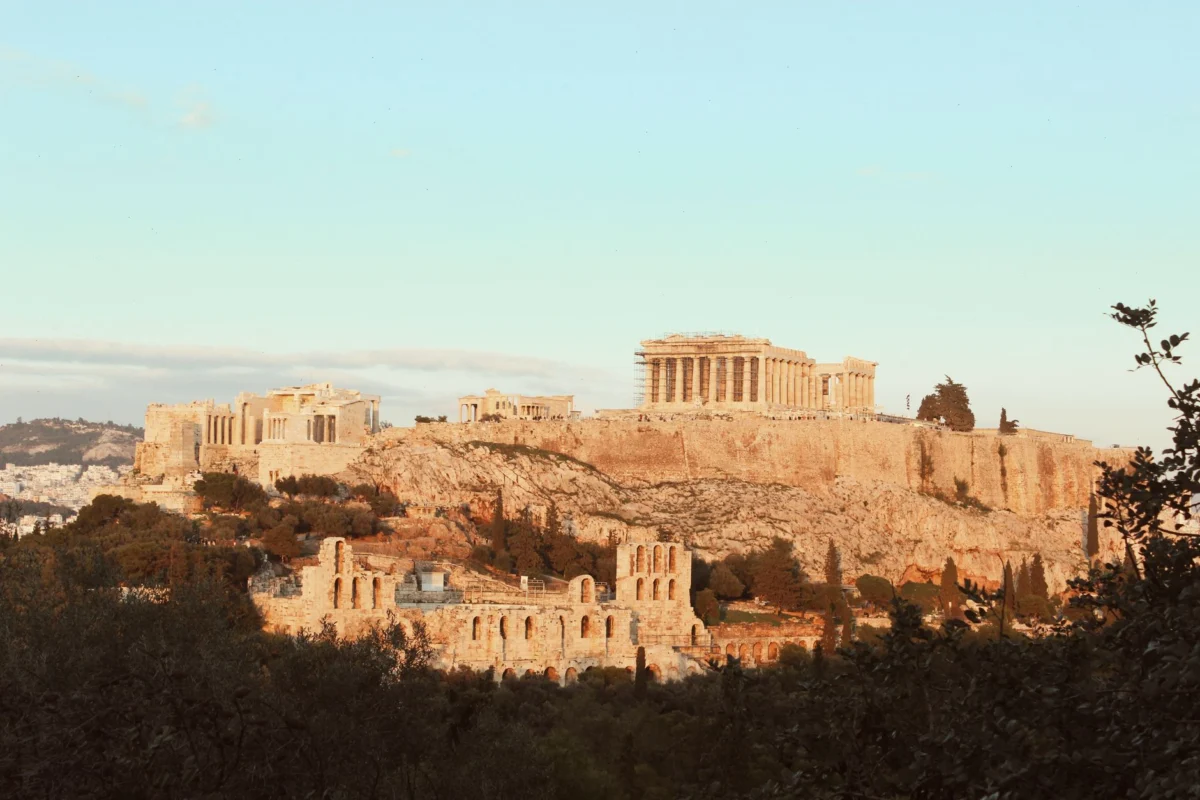 View of the Athens Acropolis at sunset showcasing its brilliant architecture