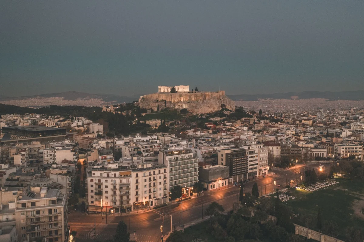 Iconic Athens Acropolis surrounded by city lights