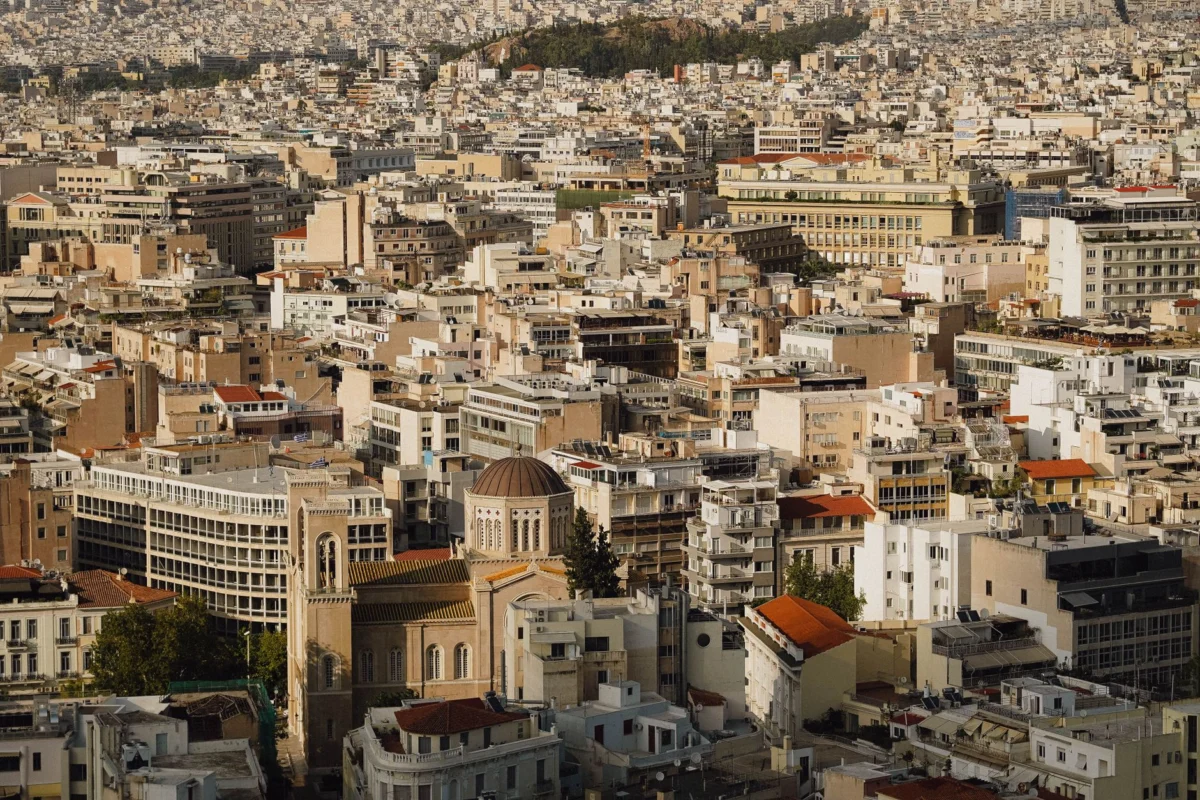Athens city skyline at sunset with ancient landmarks
