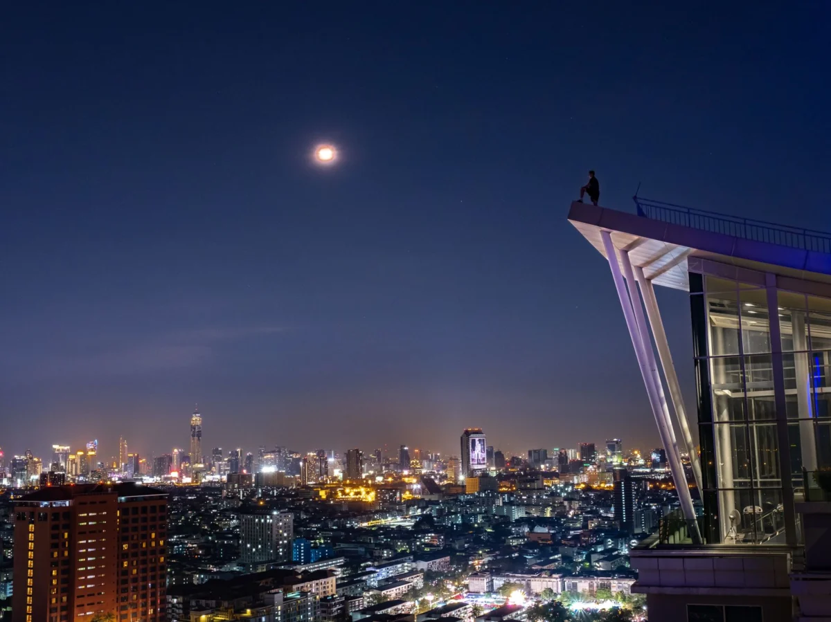 Scenic view of Bangkok skyline at sunset with iconic rooftops