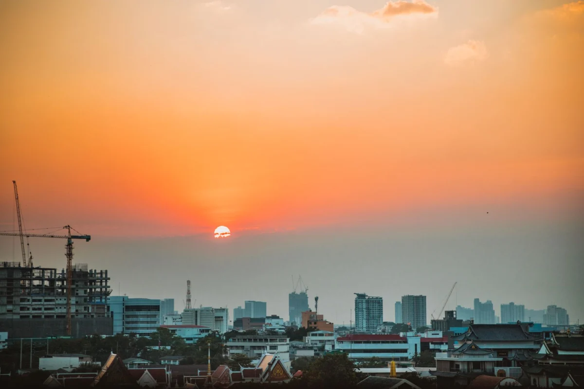 View of Bangkok skyline and Chao Phraya River at sunset