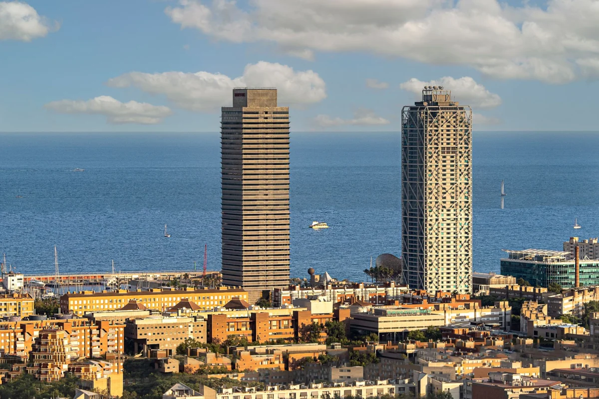 A picturesque view of Barcelona skyline at sunset with a romantic atmosphere