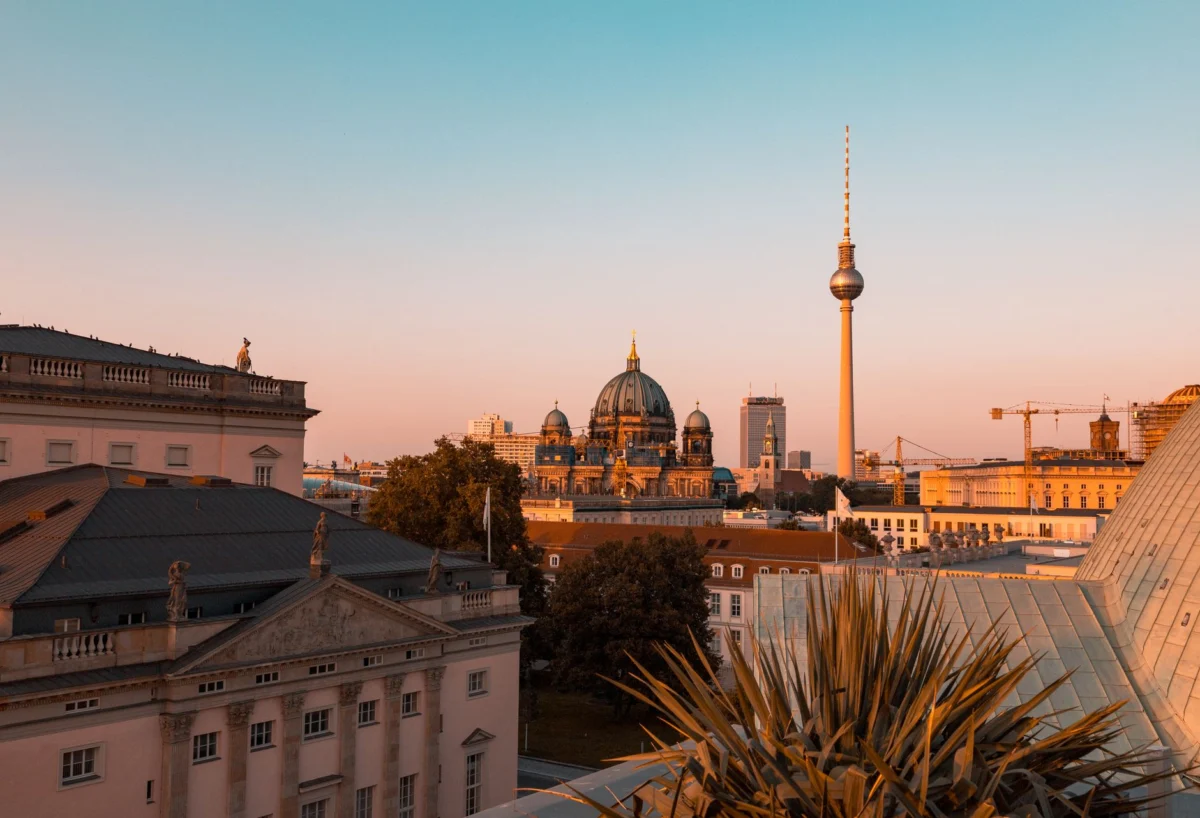 Historic Berlin skyline at sunset with iconic landmarks