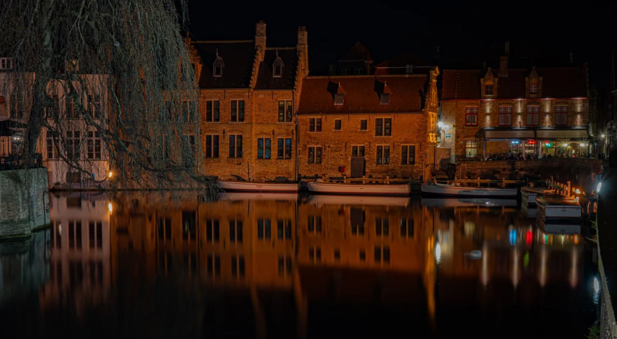 Romantic view of Bruges canals at sunset