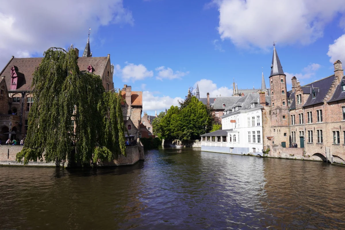 A picturesque view of Bruges' iconic canals at sunset