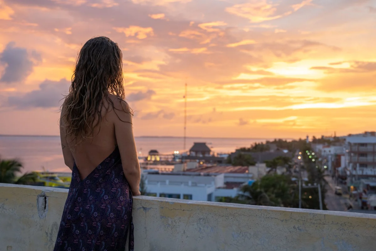 Couple enjoying a romantic view of the Cancun skyline at sunset