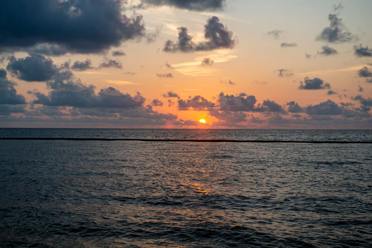 Scenic view of Cancun's skyline at sunset, featuring vibrant cityscape