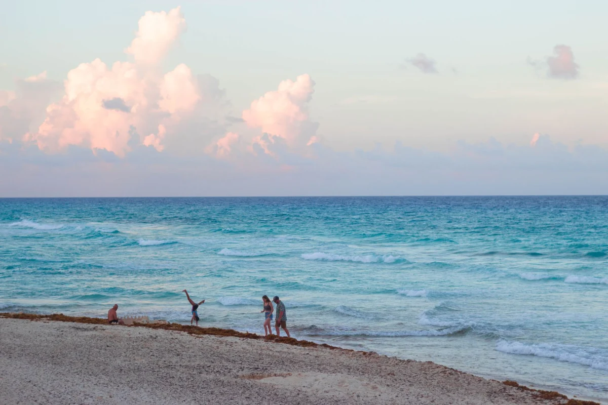 A stunning view of Cancun's skyline along the beach at sunset