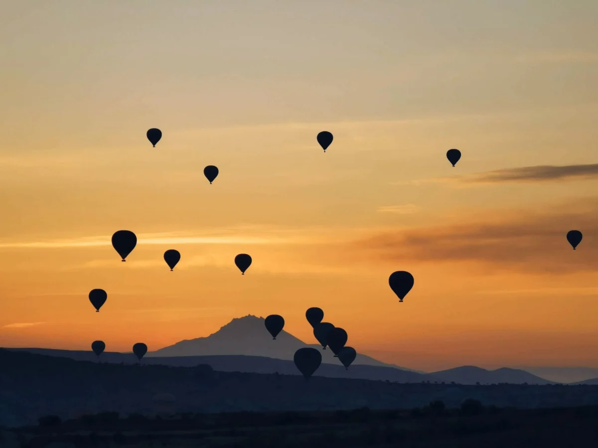 Romantic hot air balloons over Cappadocia at sunset