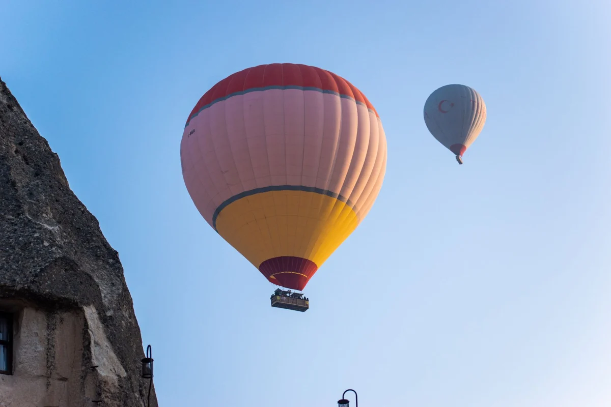 Hot air balloons floating over Cappadocia at sunrise