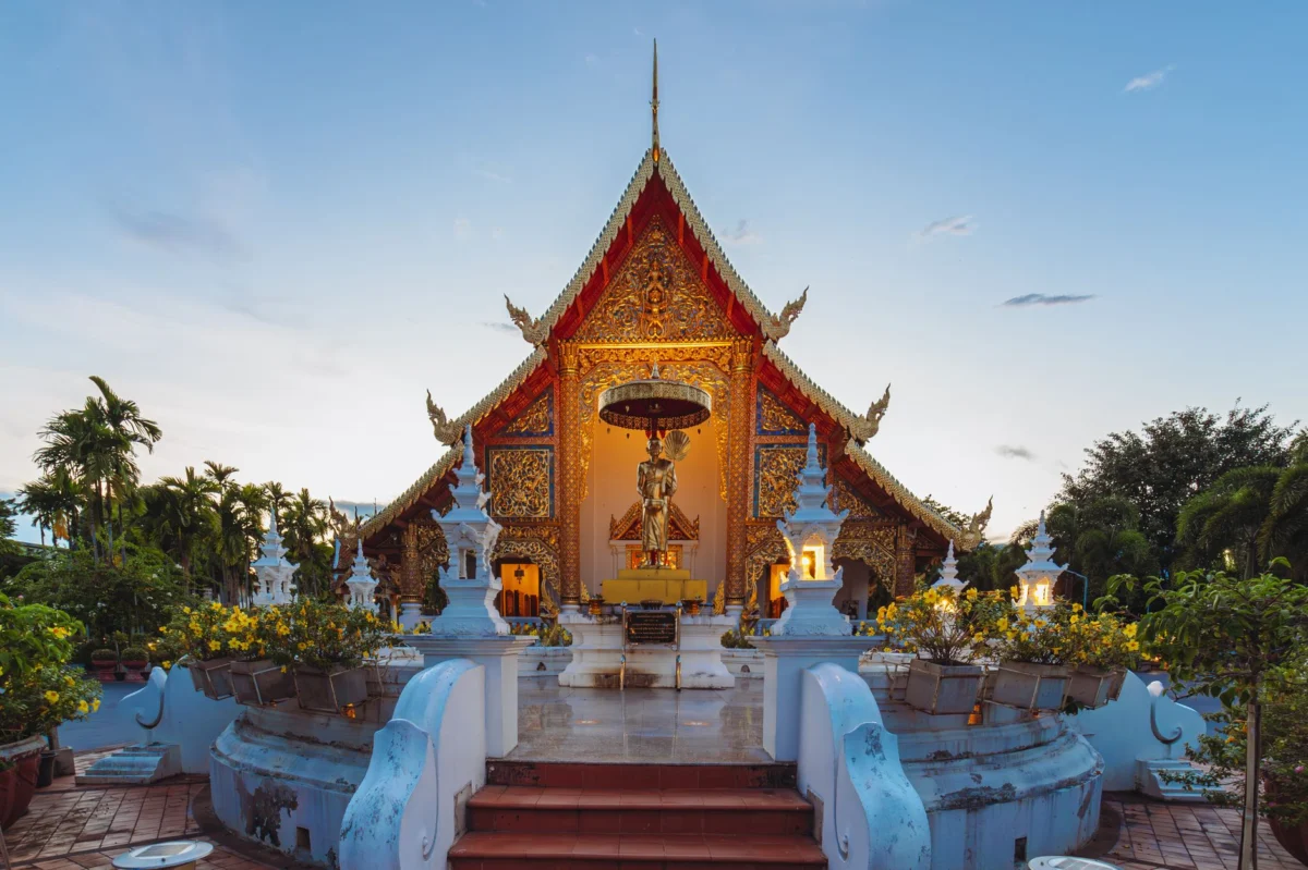 Golden sunset over a historic temple in Chiang Mai