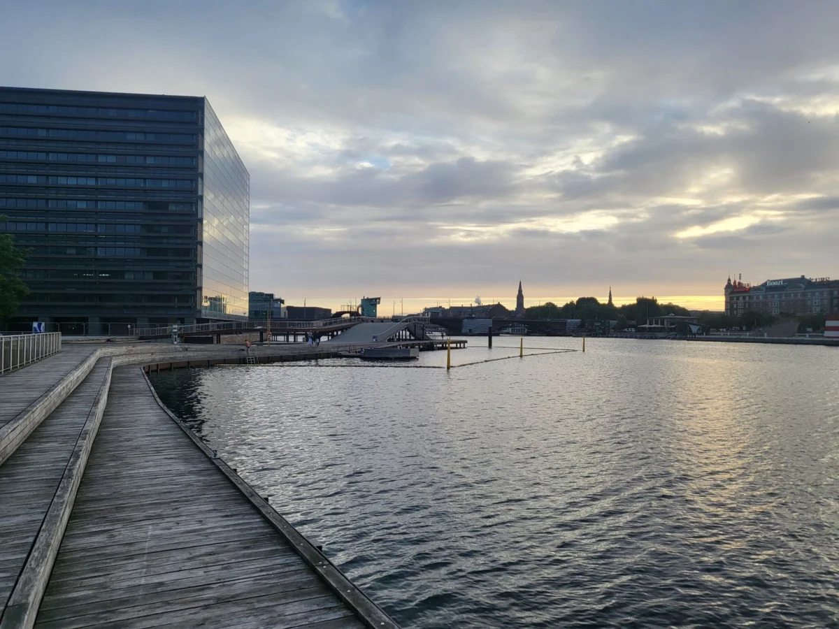 Scenic nighttime view of Copenhagen's skyline with lights