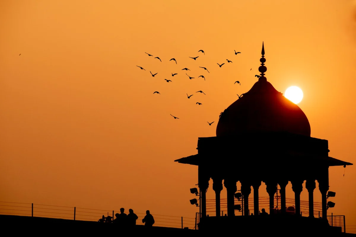 Delhi skyline with historical landmarks at sunset