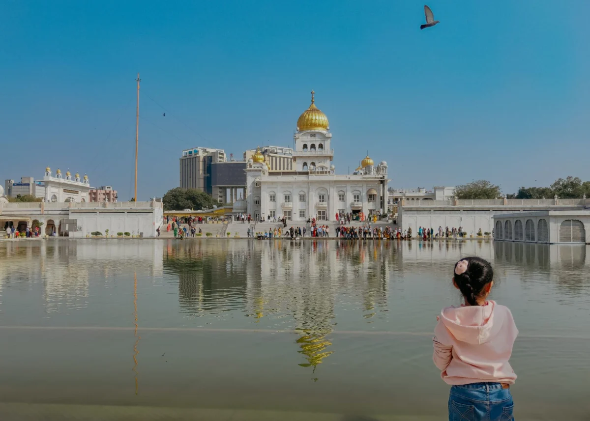 A spiritual temple with the Delhi skyline in the background