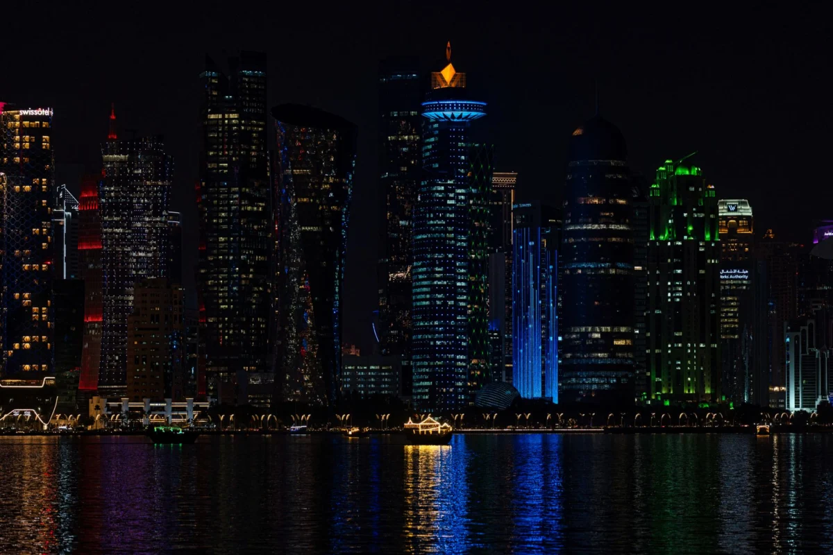 Illuminated Doha skyline with iconic skyscrapers at night