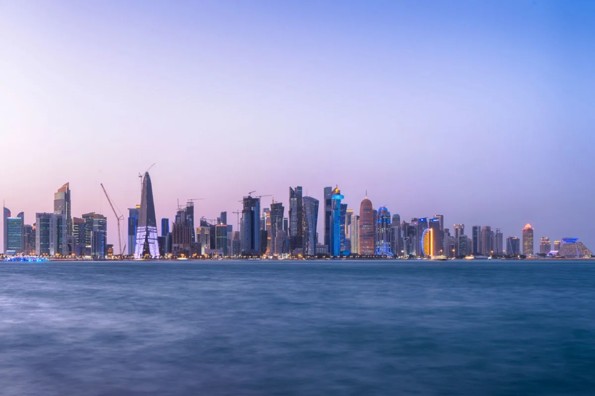 Romantic view of Doha's skyline at dusk with iconic landmarks