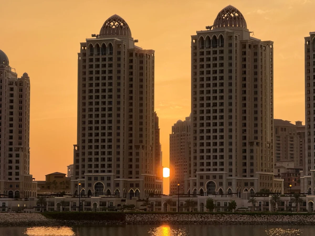 Doha skyline at sunset over waterfront