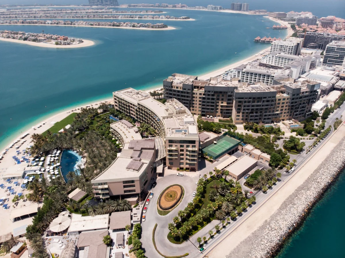 A picturesque view of a luxury hotel in Dubai at sunset