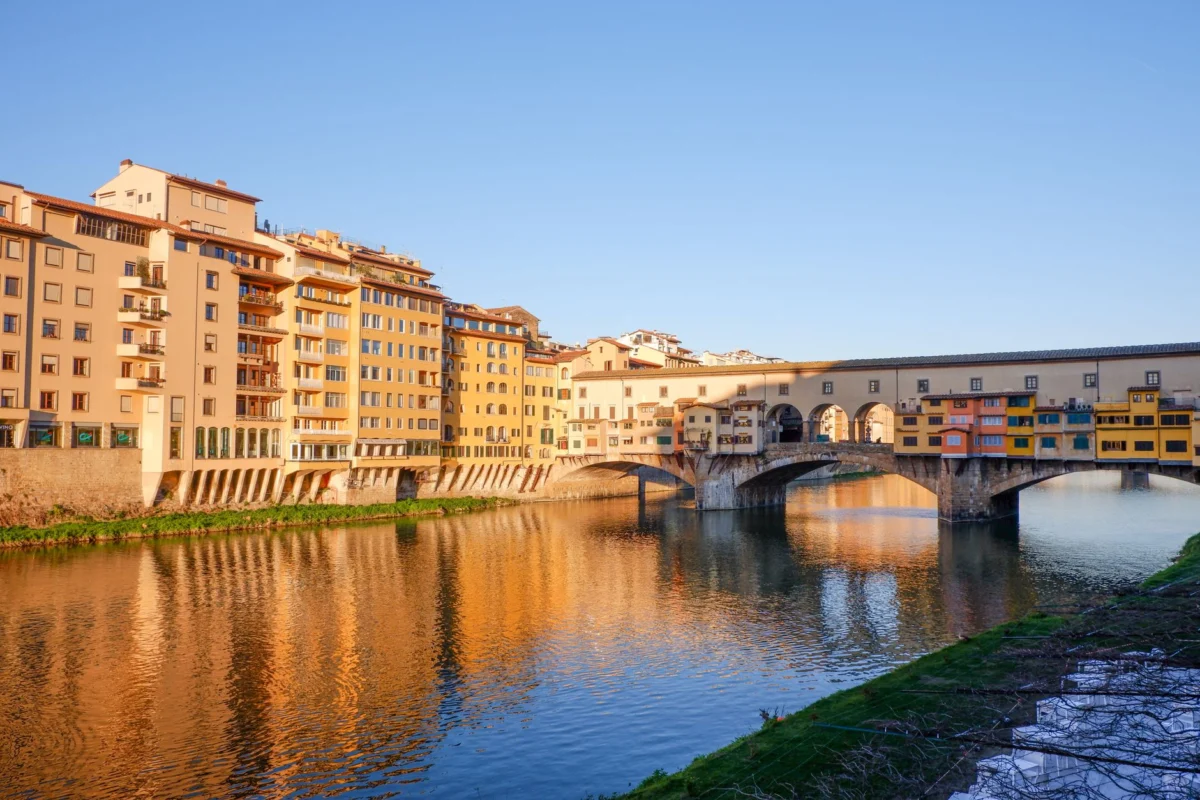 Sunset view of Ponte Vecchio over Arno River in Florence