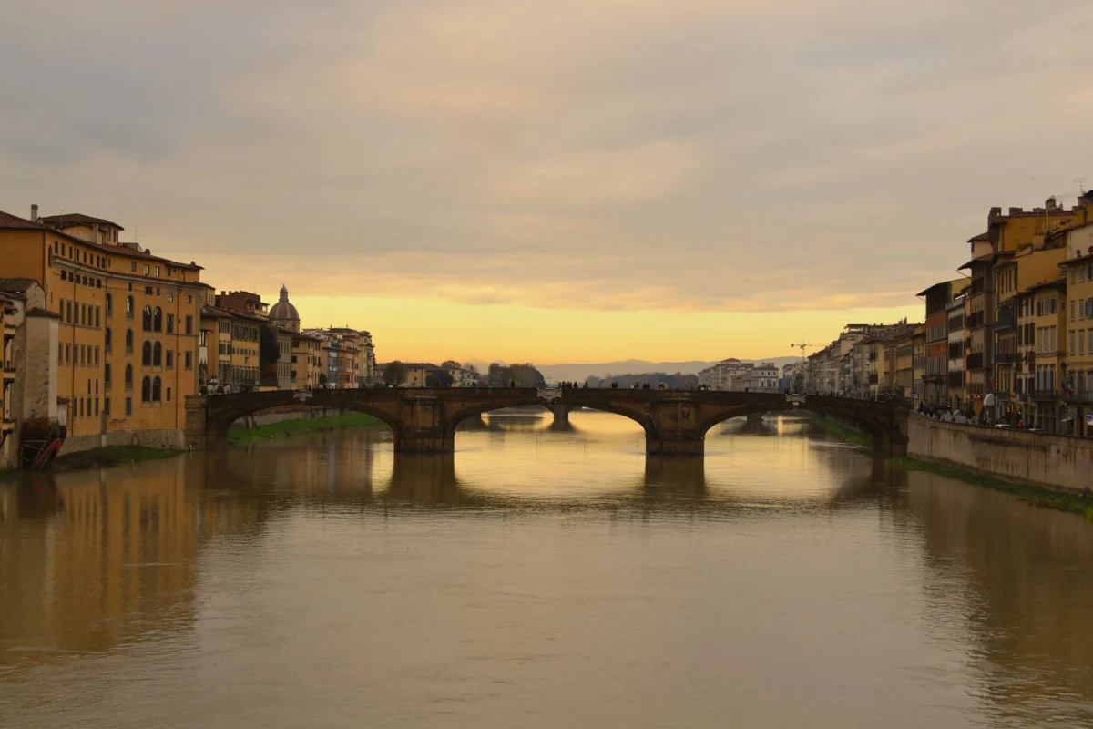 A romantic view of Ponte Vecchio at sunset in Florence