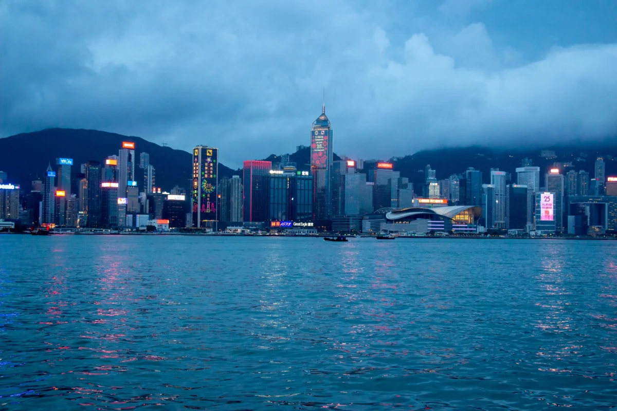 Evening view of Hong Kong skyline illuminated with city lights