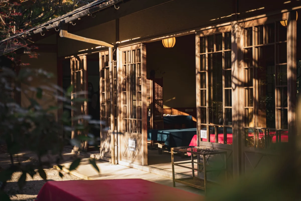 Traditional tea house in Kyoto surrounded by lush gardens