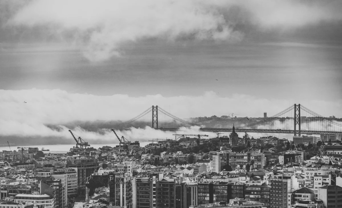 Panoramic view of Lisbon's city skyline during sunset