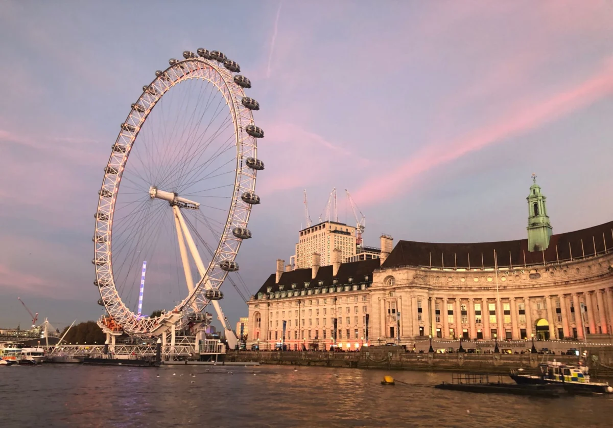 View of London's iconic skyline at sunset, capturing cultural allure