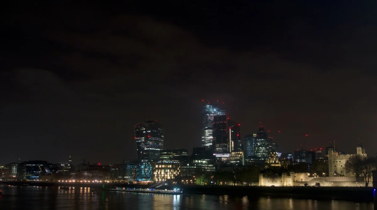 A romantic view of the London skyline at night with iconic landmarks
