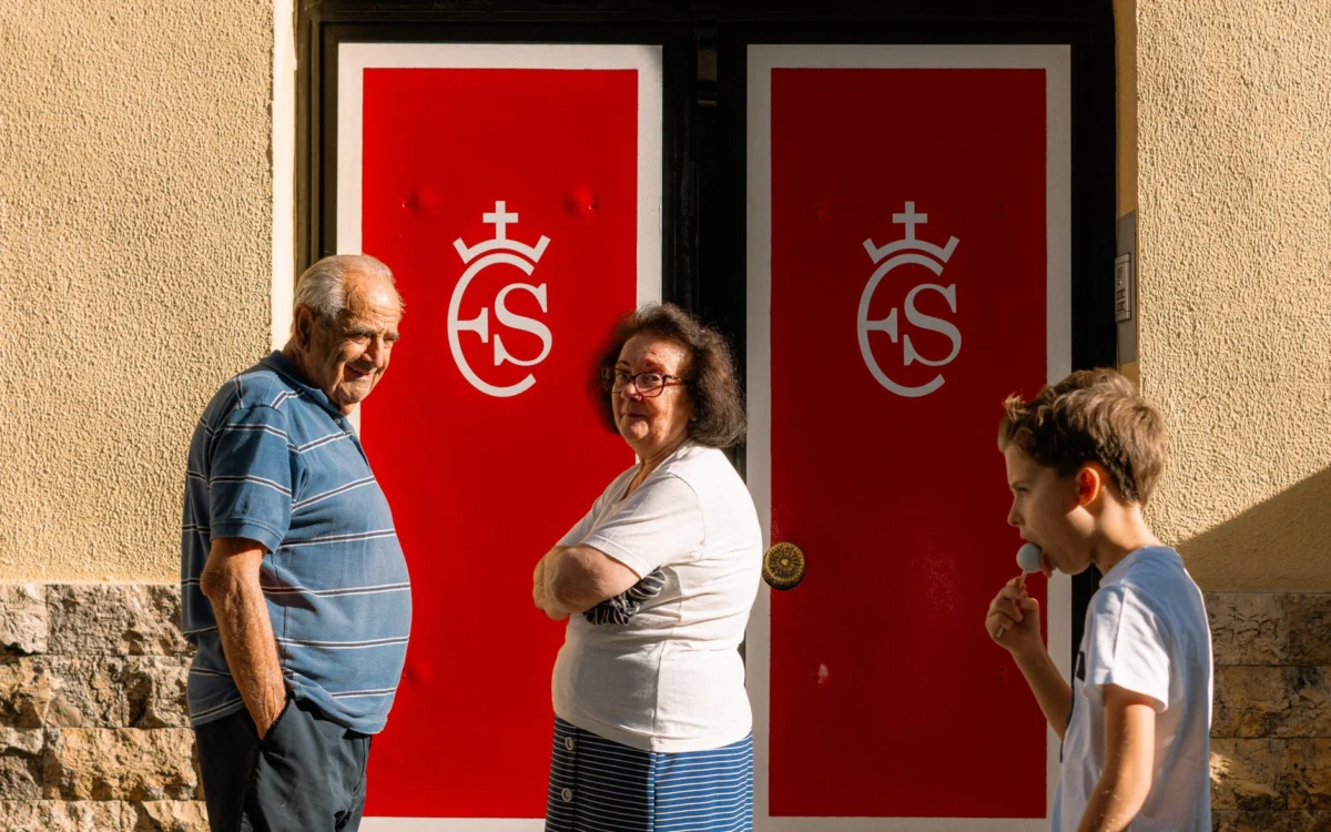 View of family-friendly neighborhood streets in Madrid with families walking
