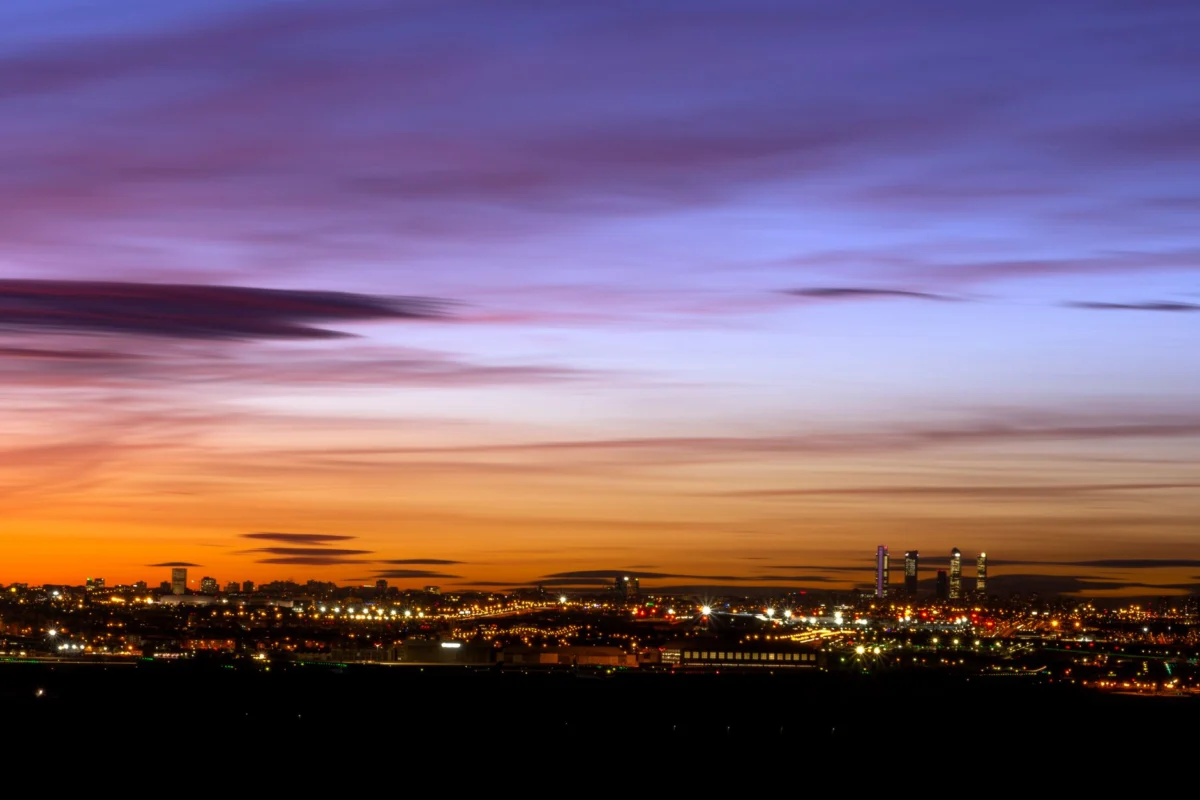 Sunset over Madrid skyline showcasing iconic landmarks