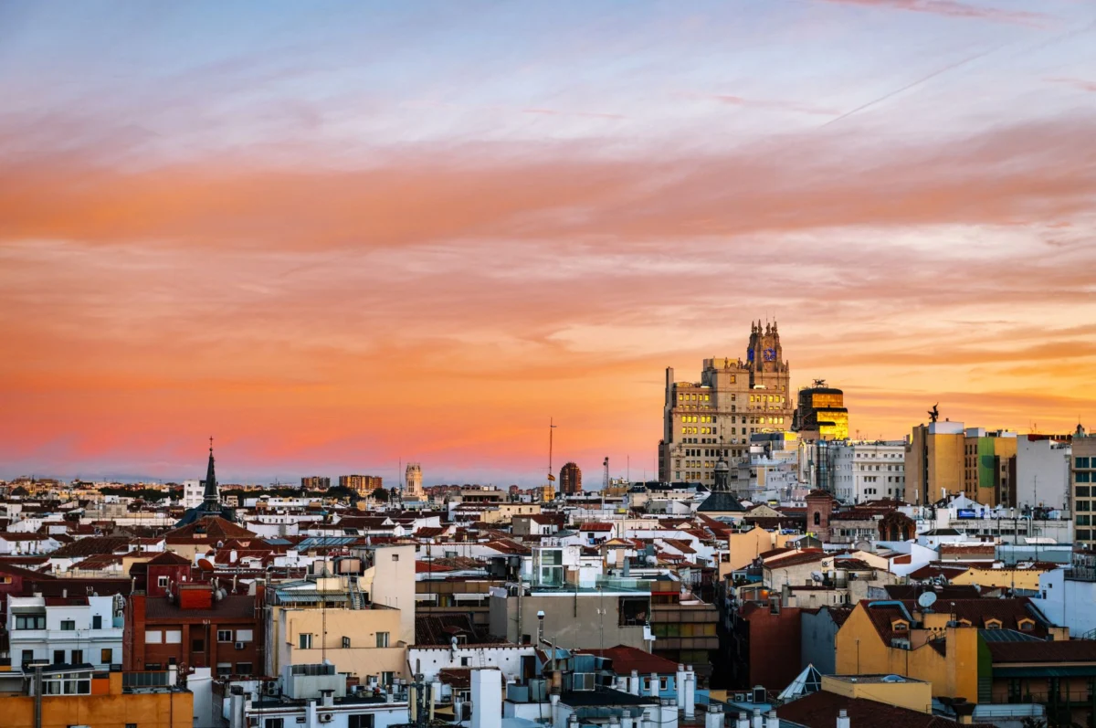 Dramatic sunset over Madrid skyline ideal for romantic getaway