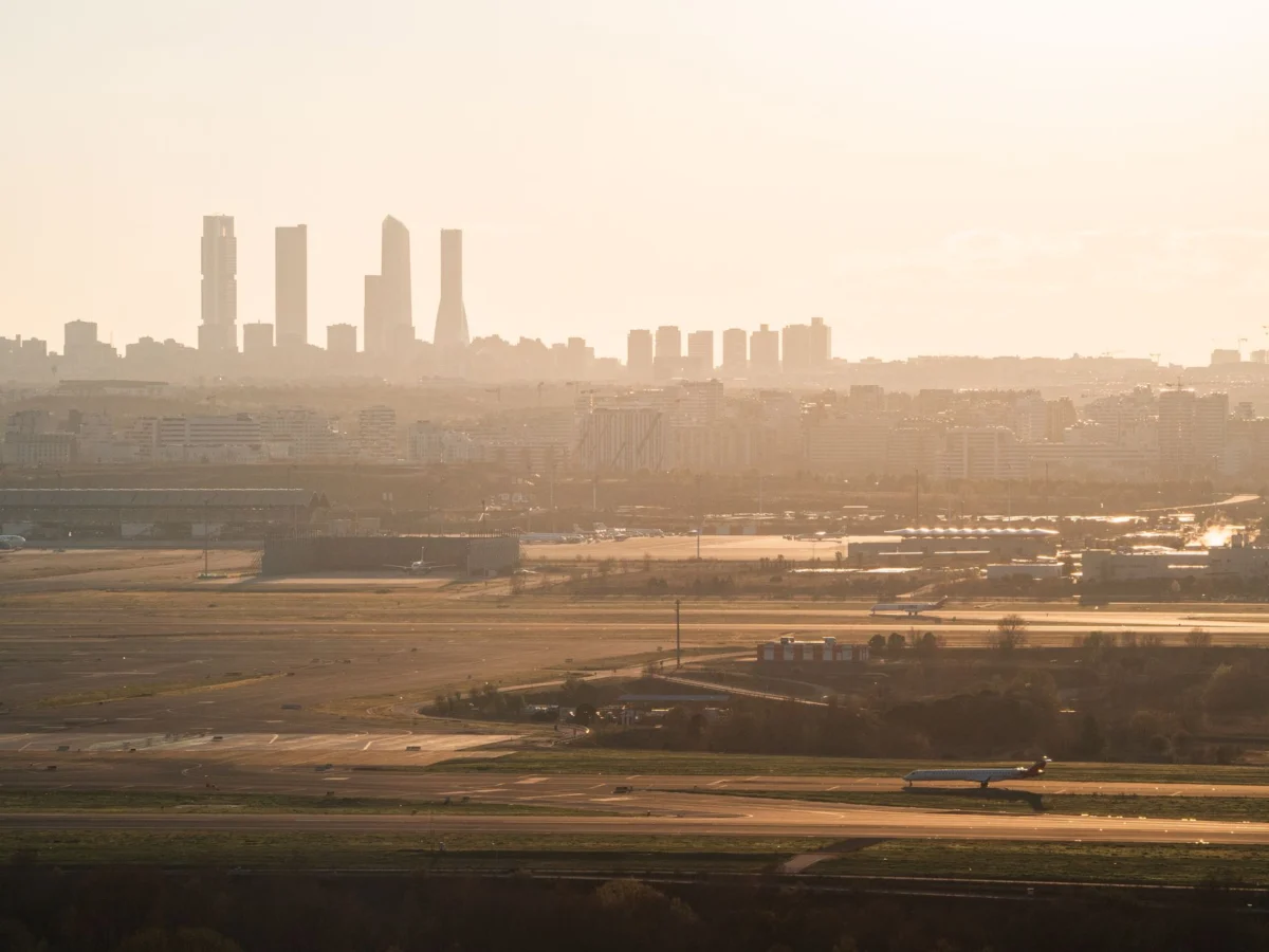 Sunset over Madrid's skyline highlighting the city's romantic and authentic appeal