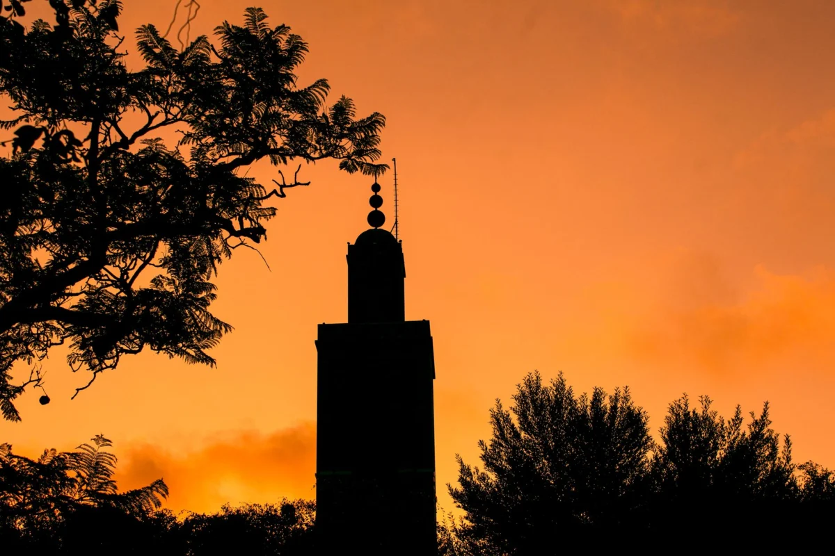Romantic view of Marrakech skyline at sunset with couple in foreground
