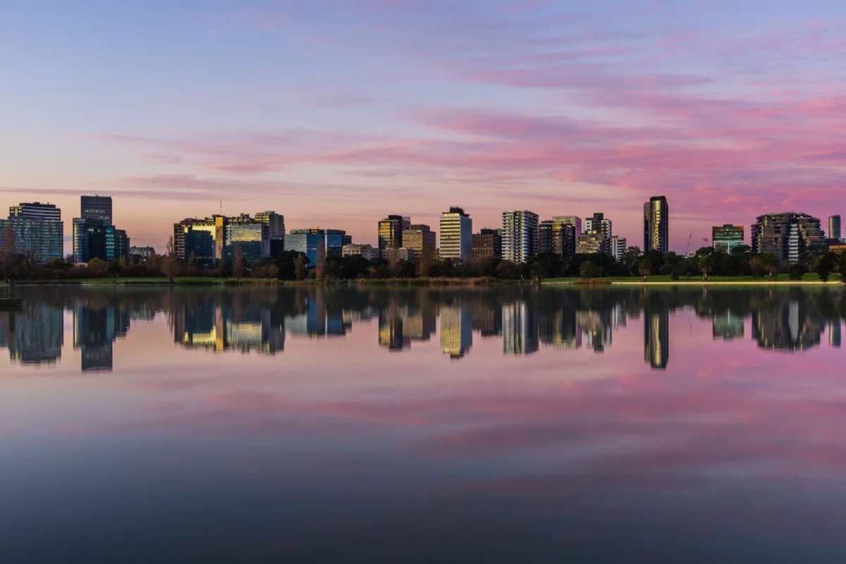 View of Melbourne skyline with iconic buildings at sunset