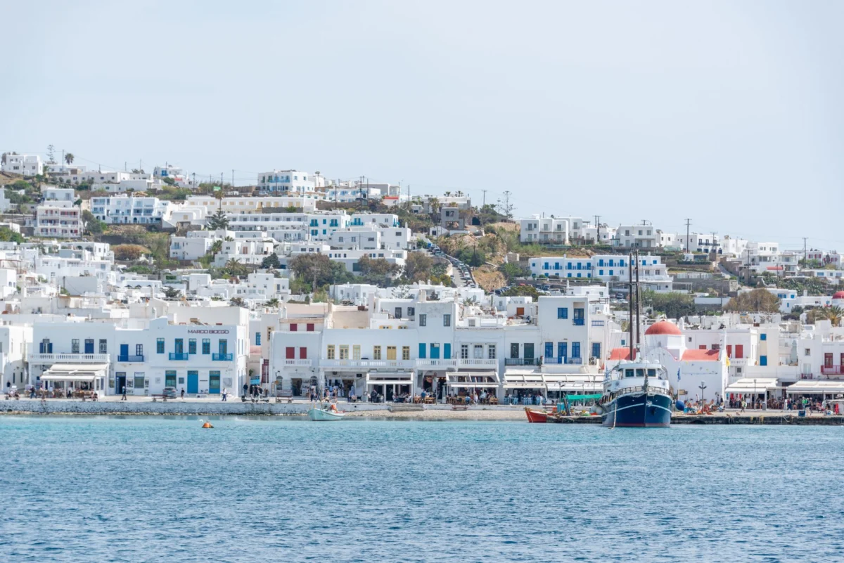 Charming view of Mykonos town harbor at sunset