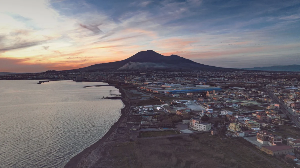 Romantic sunset view over Naples skyline