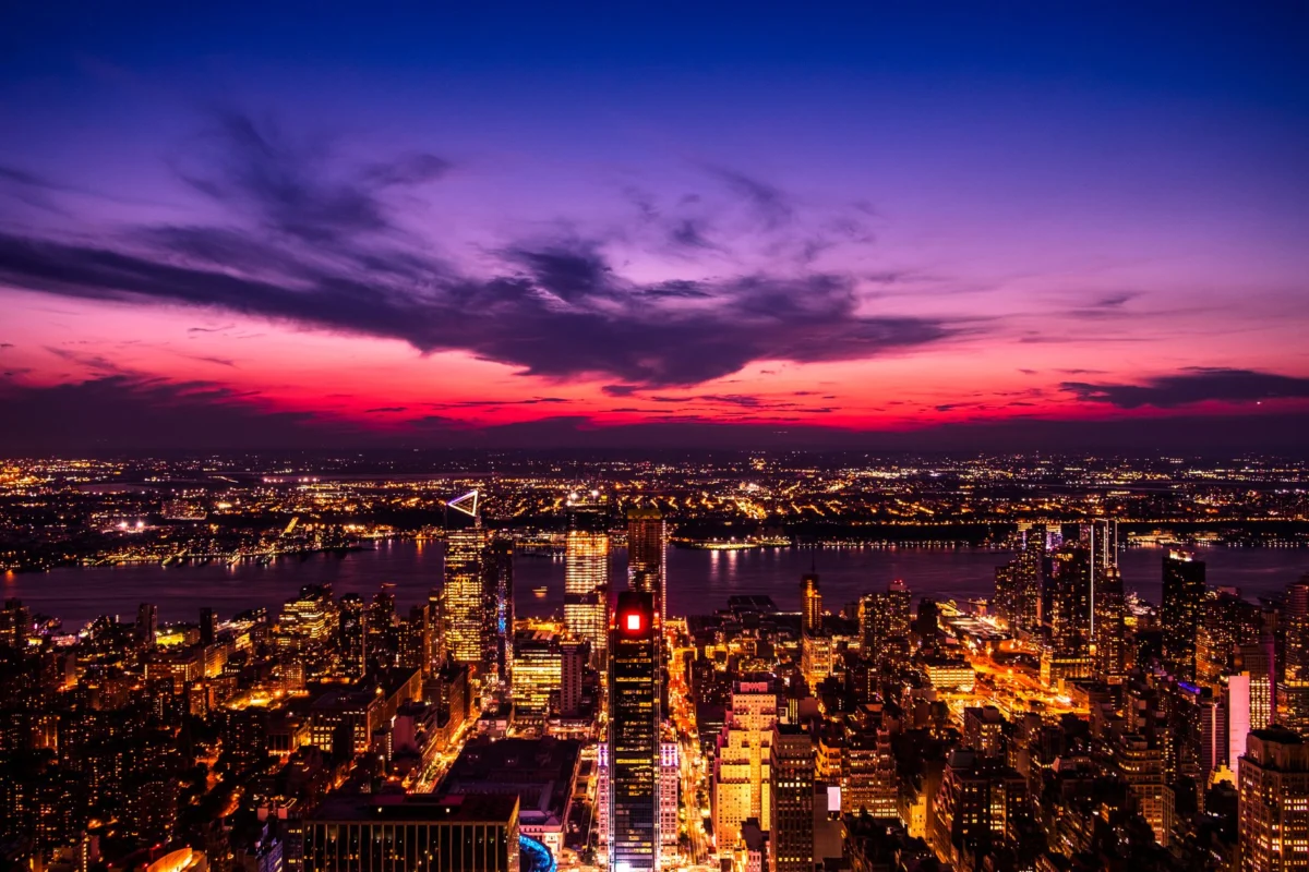 Romantic sunset over New York skyline viewed from a luxury hotel