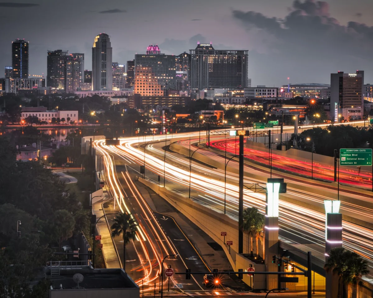 A vibrant view of the Orlando skyline at night, highlighting the city's attractions