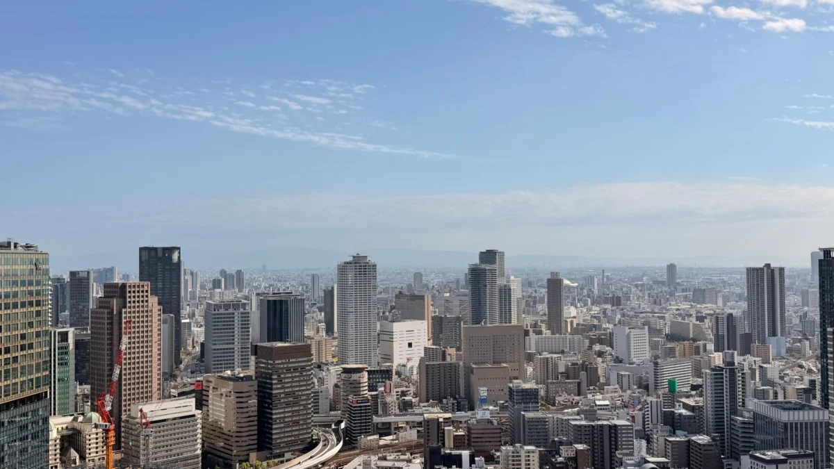 Bird's-eye view of Osaka city skyline, highlighting major neighborhoods.