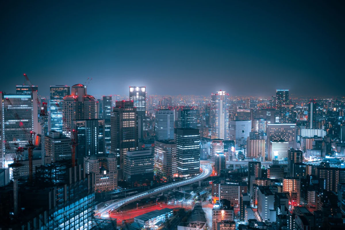 Night view of Osaka skyline with city lights reflecting in water