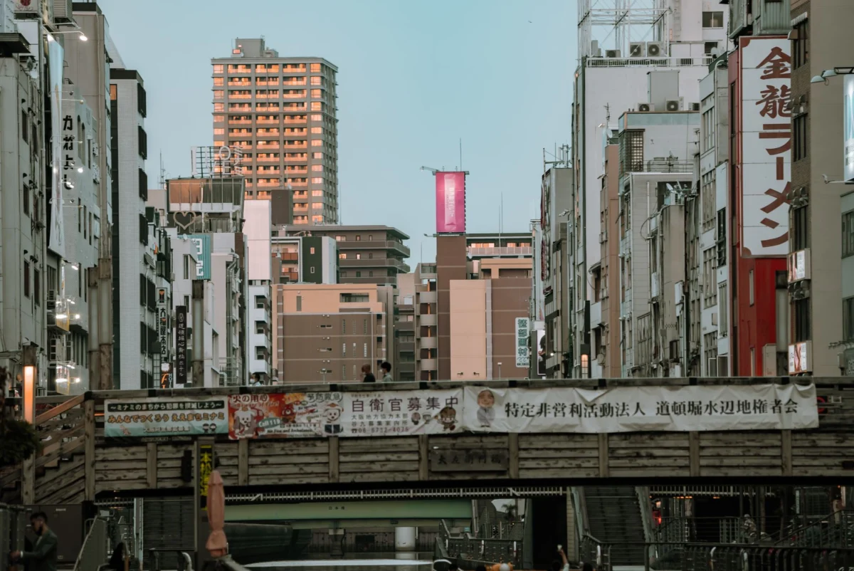 Dynamic cityscape of Osaka featuring iconic Dotonbori landmarks