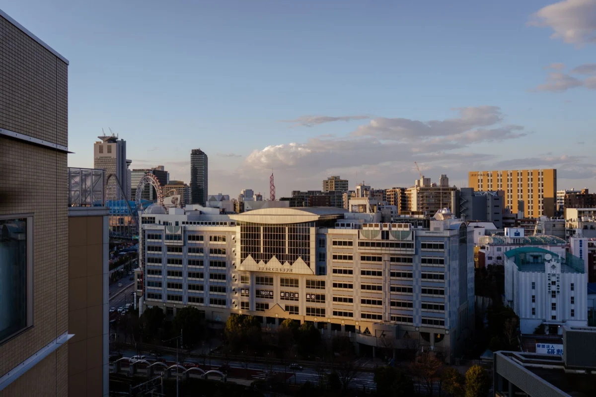 Osaka skyline illuminated at dusk with modern architecture